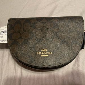 NWT Black/Brown Coach small purse never used nor strapped unwrapped.